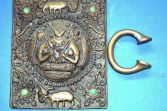 Antique African Benin bronze plaque and child's Manilla 'slave' bracelet, c1920